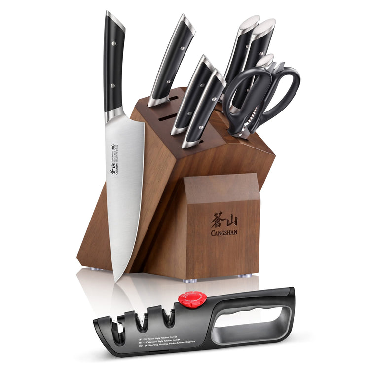 Wooden knife block holding six knives and kitchen scissors, with a separate black knife sharpener in front.