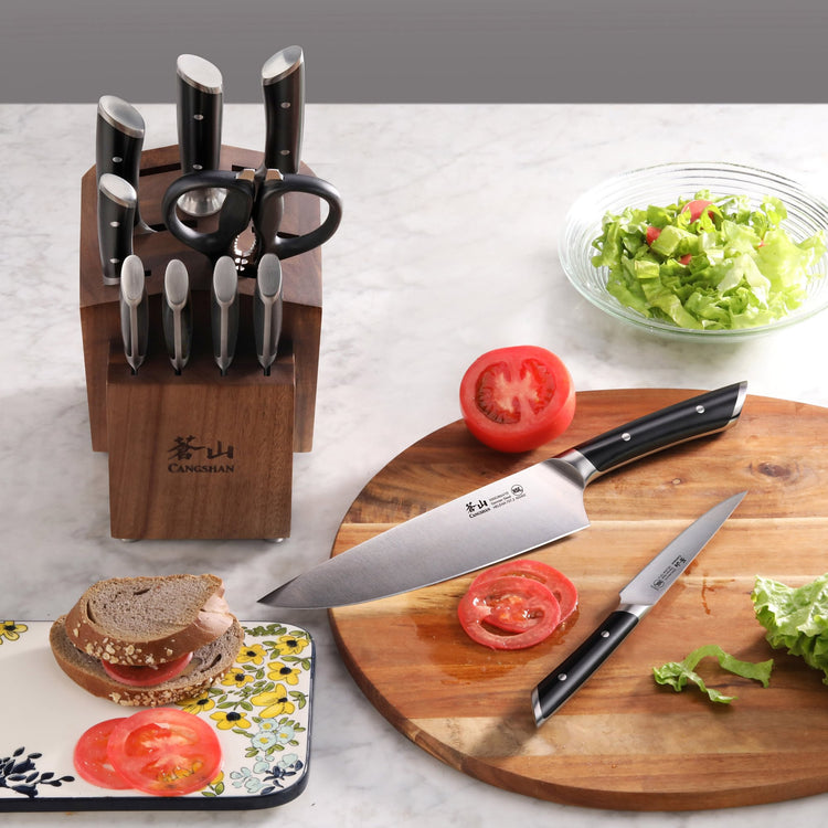 12-piece knife set with acacia block, including chef's knife, paring knife, scissors, and steak knives on a marble countertop