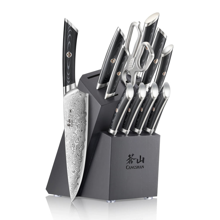 12-piece knife set with patterned blades, black handles, scissors, and a black angled wooden block with logo.