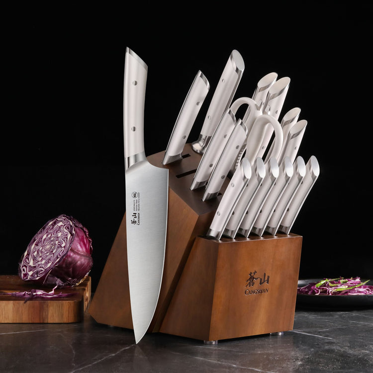 17-piece knife set with stainless steel blades and handles in a wooden block on a kitchen counter.