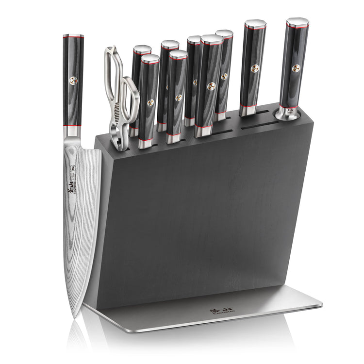 Knife block set with eight knives, kitchen shears, and sharpening rod in a black wooden block with metal base.