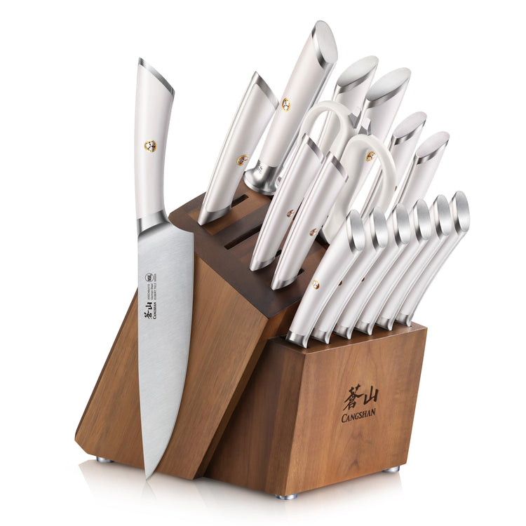 Wooden knife block holding 17 stainless steel knives with curved handles arranged by size and type.