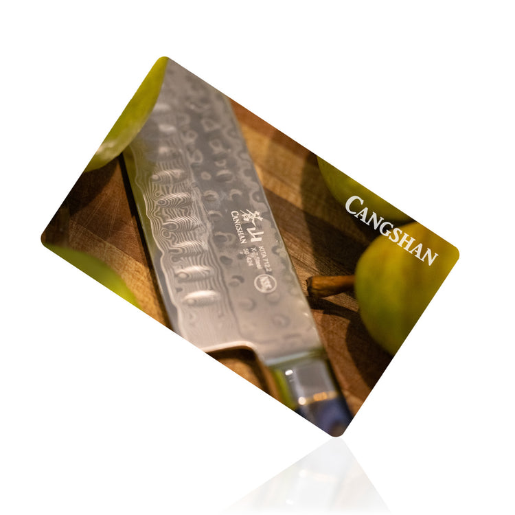 Cangshan cutlery gift card featuring a textured knife blade next to green pears on a cutting board.