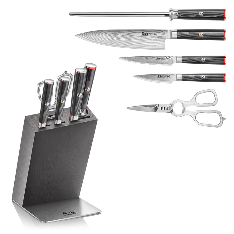 Six-piece knife set with four knives, sharpening rod, kitchen shears, and black angled block with metal base.