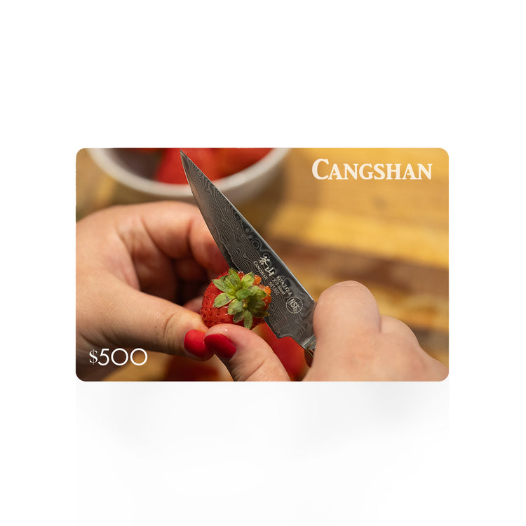 Cangshan $500 gift card with a photo of hands trimming a strawberry with a paring knife.