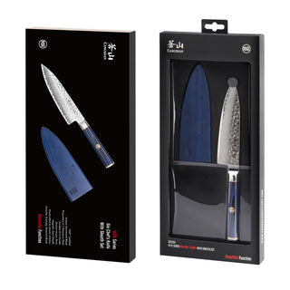 
                    
                      6-inch chef's knife with blue handle and textured blade, shown with matching blue sheath in black packaging.
                    
                  