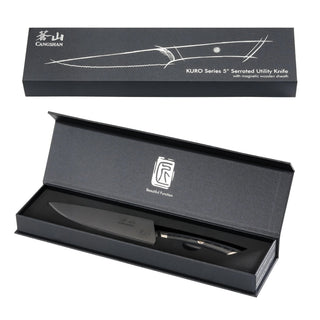 
                    
                      KURO Series 5-inch serrated utility knife with black handle and sheath, displayed in an open black presentation box.
                    
                  