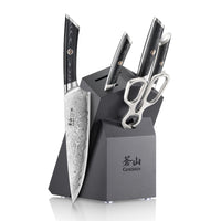Six-piece knife set with patterned blades, black handles, scissors, and a black angled block with "CANGSHAN" logo.