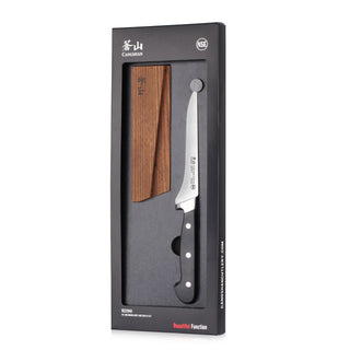 
                    
                      Japanese-style kitchen knife with wooden sheath in black packaging labeled "Cangshan" and "NSF" certification.
                    
                  