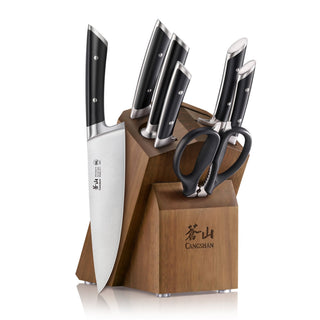 
                    
                      Eight-piece knife set with black handles in a wooden block, including kitchen scissors and a knife sharpener slot.
                    
                  