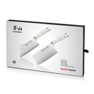 
                    
                      Two cleaver knives with light-colored handles displayed on a white box with black edges and text.
                    
                  