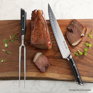 
                    
                      6-inch carving fork with black handle and two prongs on wooden cutting board with sliced roast beef and carving knife.
                    
                  