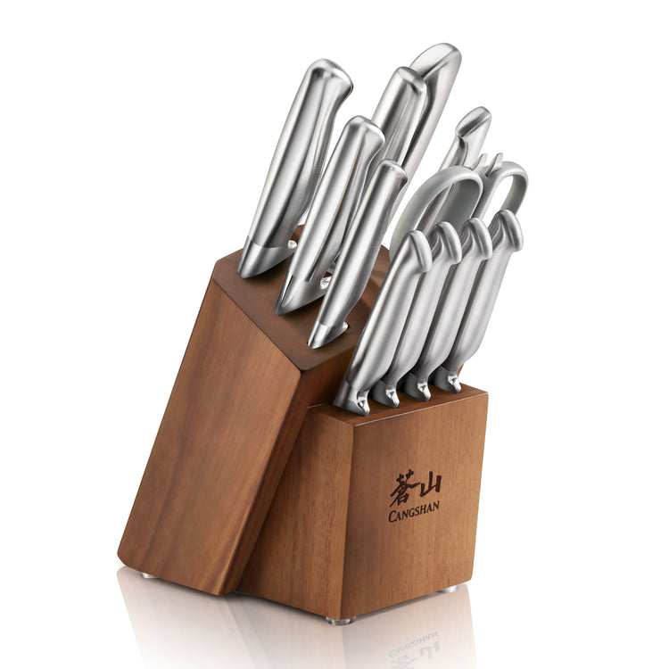 Twelve stainless steel knives with ergonomic handles in a wooden block with Chinese characters and "CANGSHAN" logo.