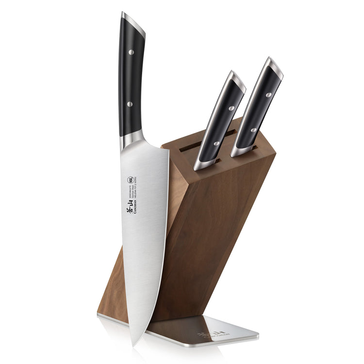 Four-piece knife set with black handles in a wooden block with a metal base.