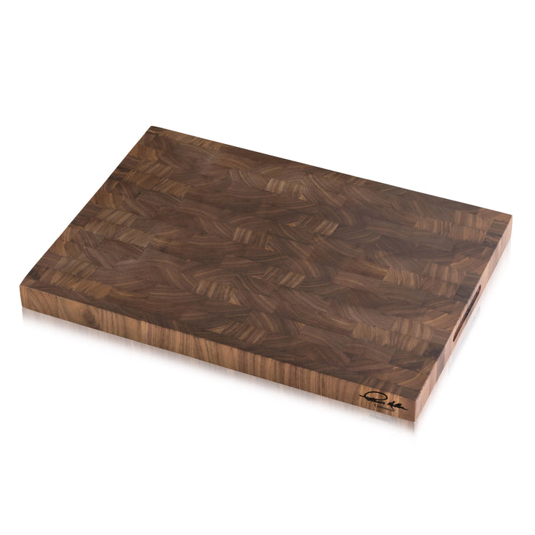 Rectangular walnut end-grain cutting board with Thomas Keller Signature Collection logo on the corner.