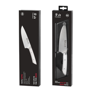 
                    
                      Two black rectangular boxes displaying a 6-inch chef's knife with a silver blade and white handle, one box showing the knife
                    
                  