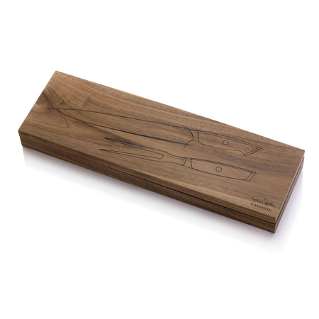 Wooden box with engraved outlines of a carving knife and fork, signed by Thomas Keller.