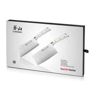 
                    
                      Two cleaver knives with light-colored handles displayed on a white box with black edges and text.
                    
                  