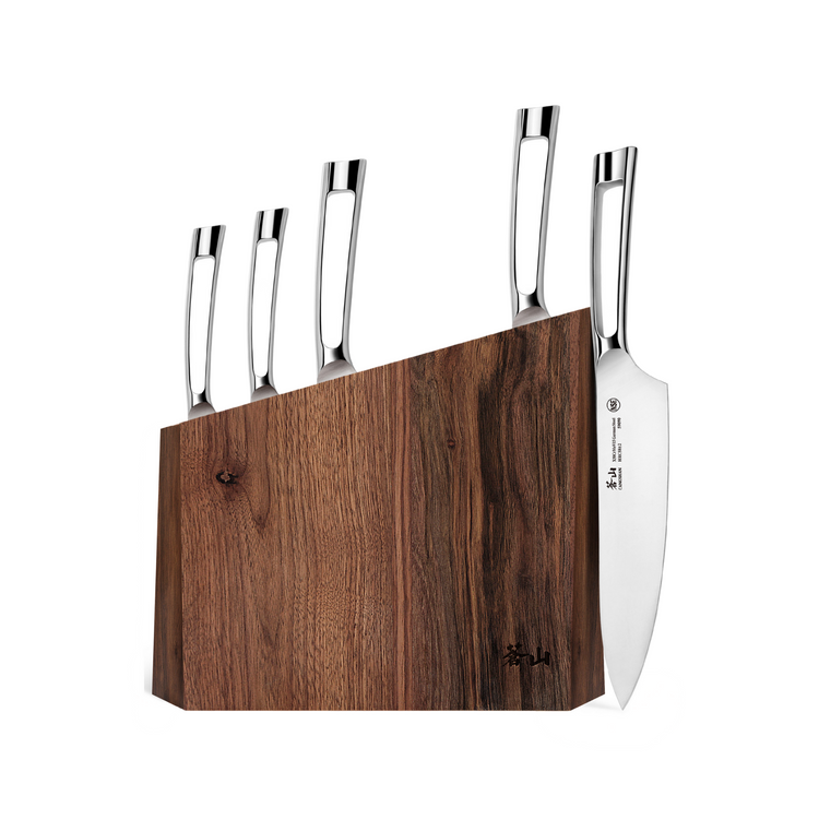 Walnut knife block holding five knives with stainless steel handles, including a chef's knife on the side.