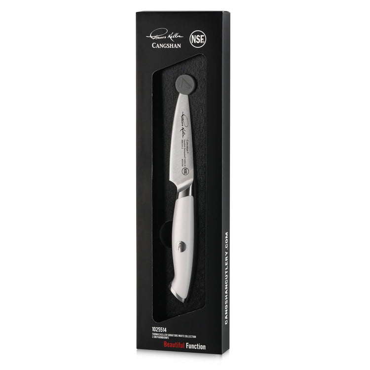 3.5-inch paring knife with white handle in black packaging, featuring engraved blade and brand logos.